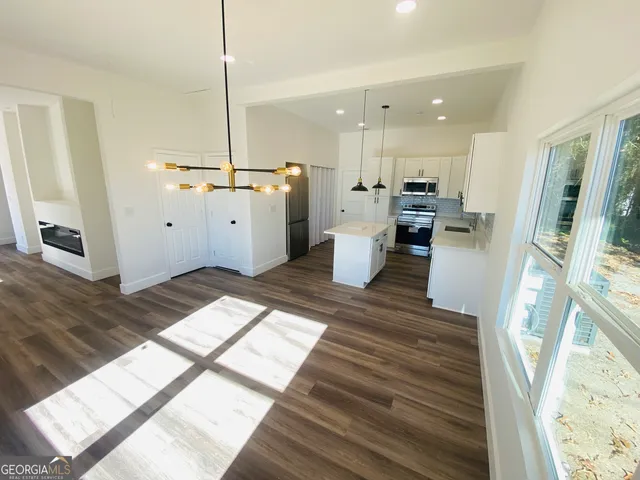 a view of a living room and hardwood floor