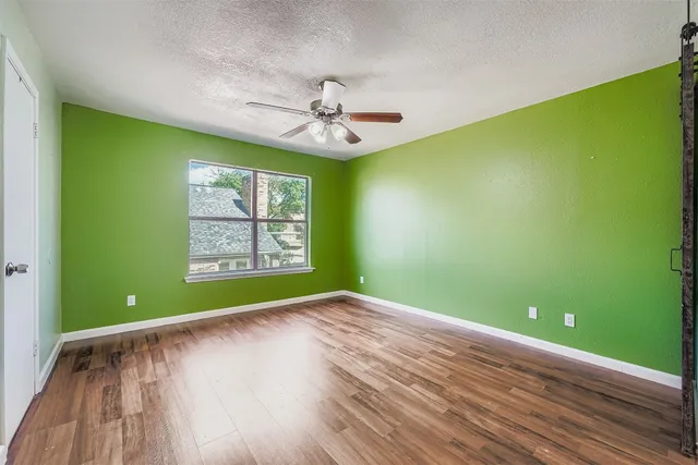 a view of room with window and fan