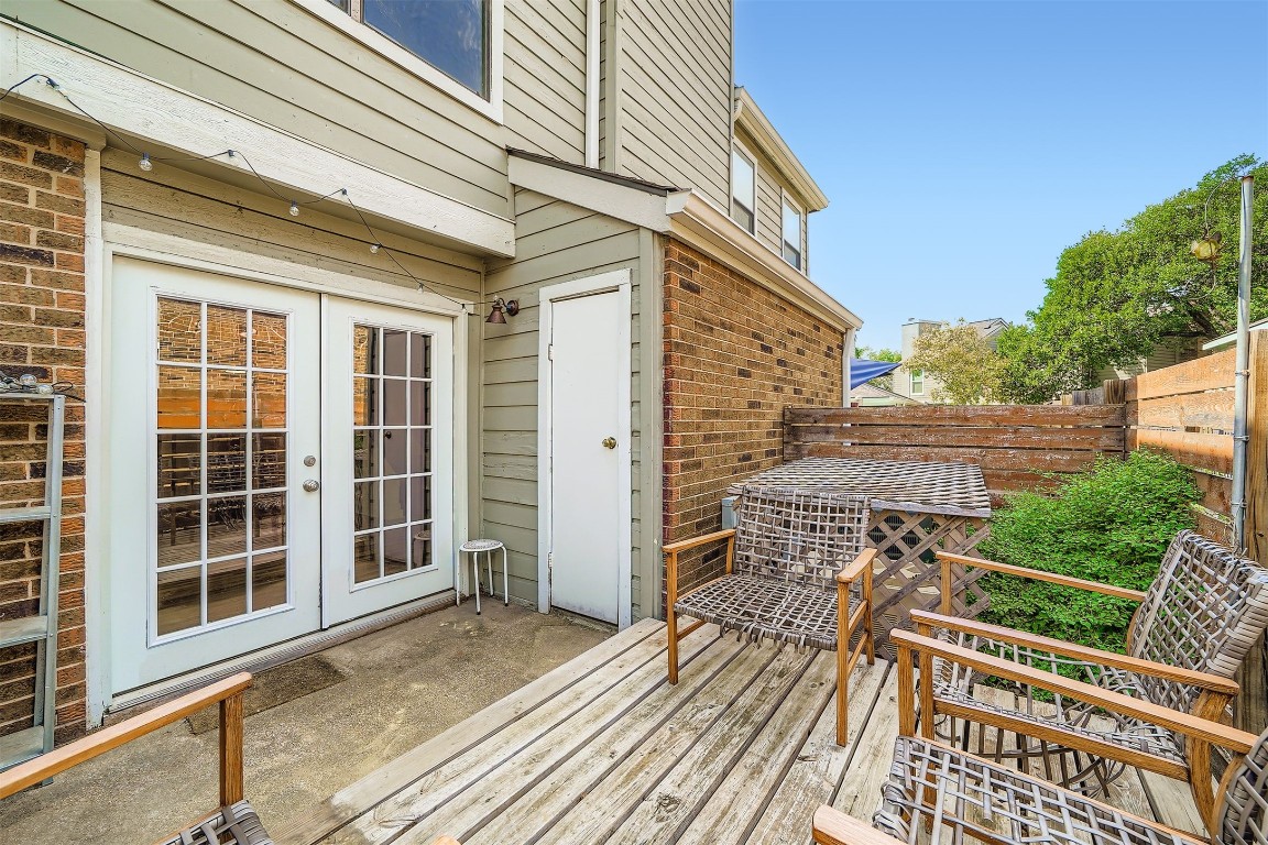 2018 West Rundberg Lane, Unit 2B Austin, TX 78758 - Photo 29 of 31 Deck with french doors and a fenced backyard
