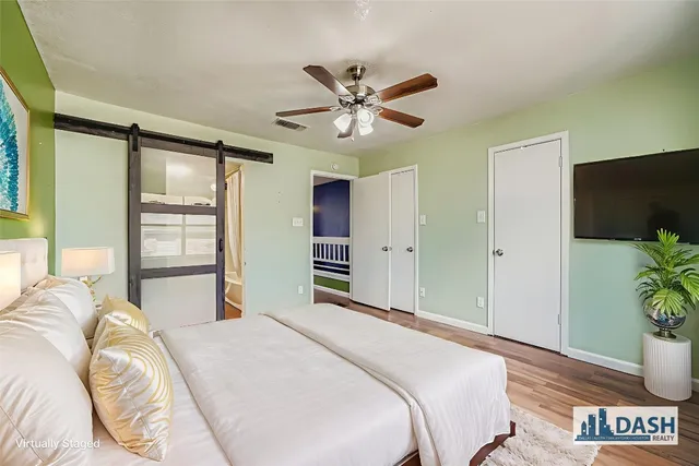 a bedroom with double bed and a window