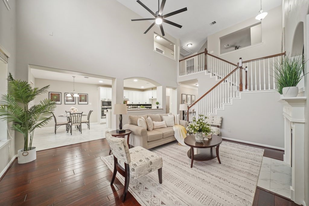 714 Coggins Point Way Sugar Land, TX 77479 - Photo 13 of 32 a living room with furniture or wooden floor and a potted plant