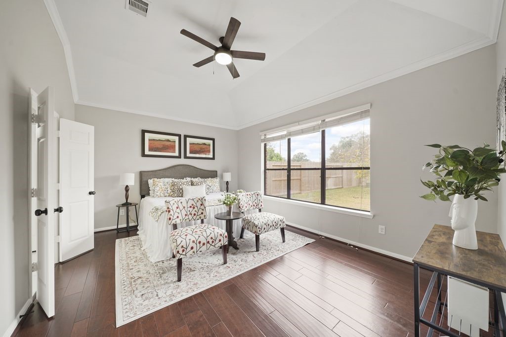 714 Coggins Point Way Sugar Land, TX 77479 - Photo 15 of 32 a living room with furniture large window and wooden floor