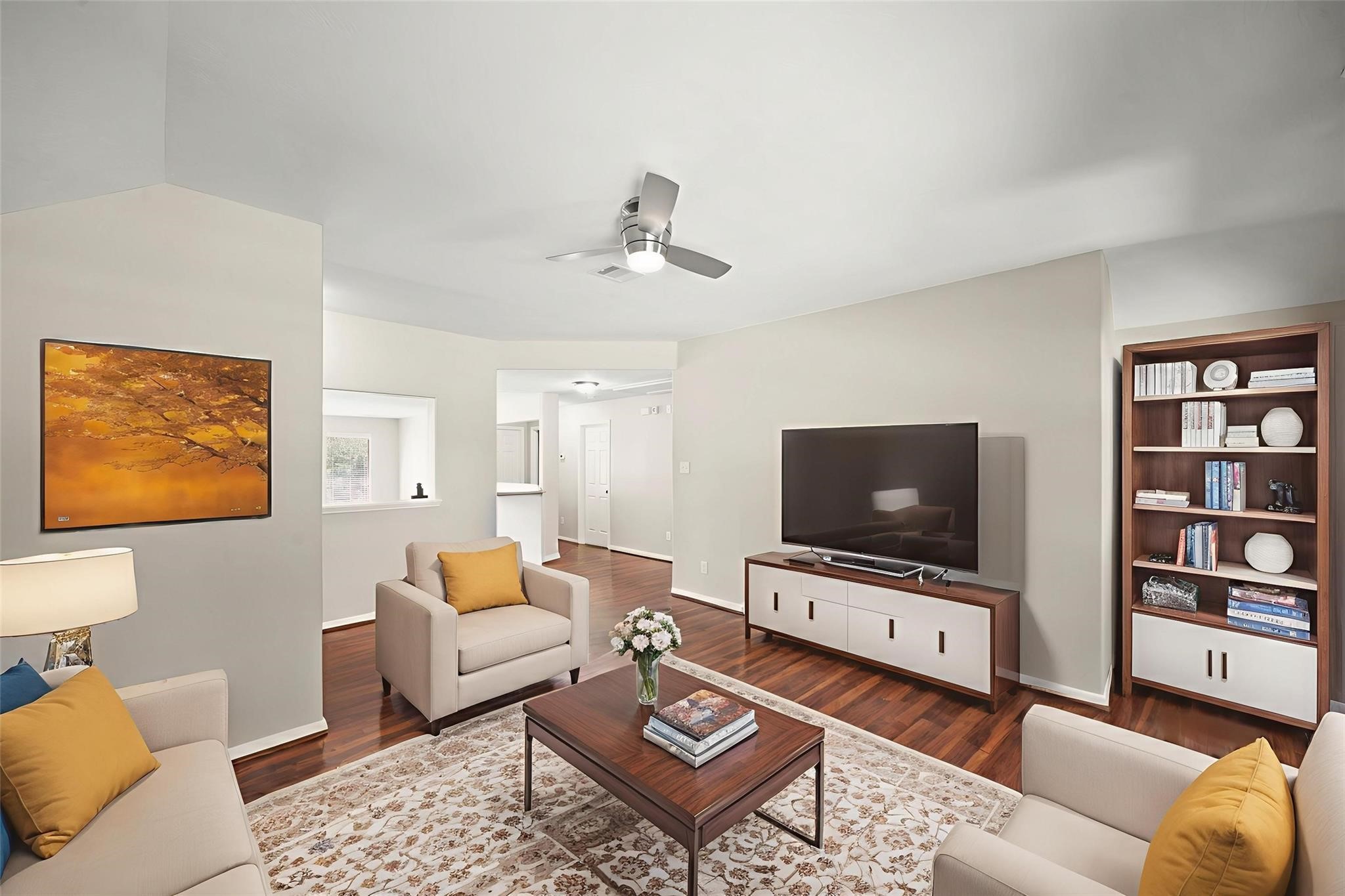 714 Coggins Point Way Sugar Land, TX 77479 - Photo 21 of 32 a living room with furniture and a flat screen tv