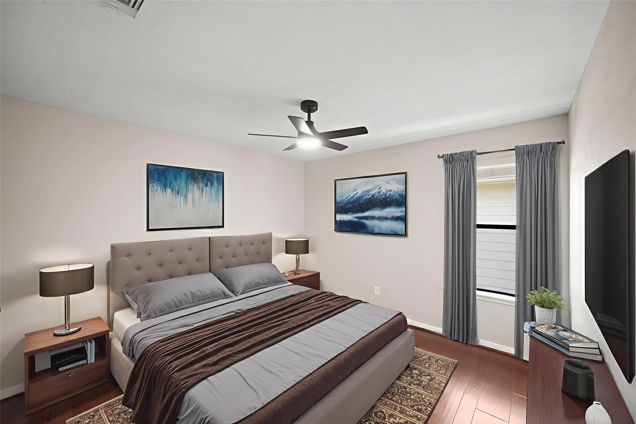 714 Coggins Point Way Sugar Land, TX 77479 - Photo 24 of 32 a bedroom with a bed and a flat screen tv