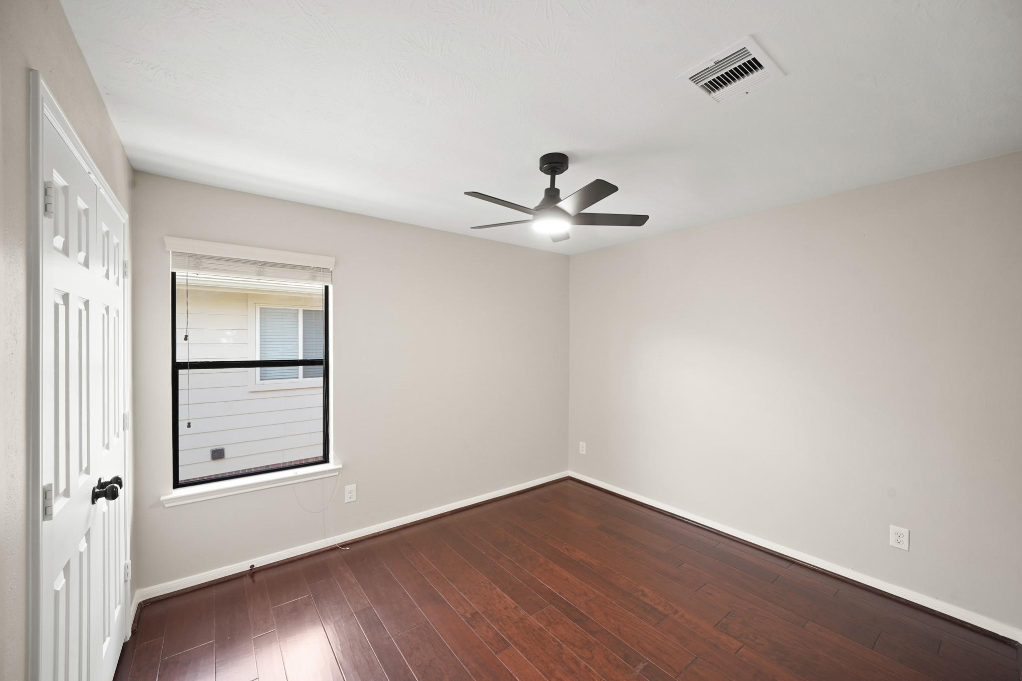 714 Coggins Point Way Sugar Land, TX 77479 - Photo 25 of 32 a view of a room with wooden floor and closet