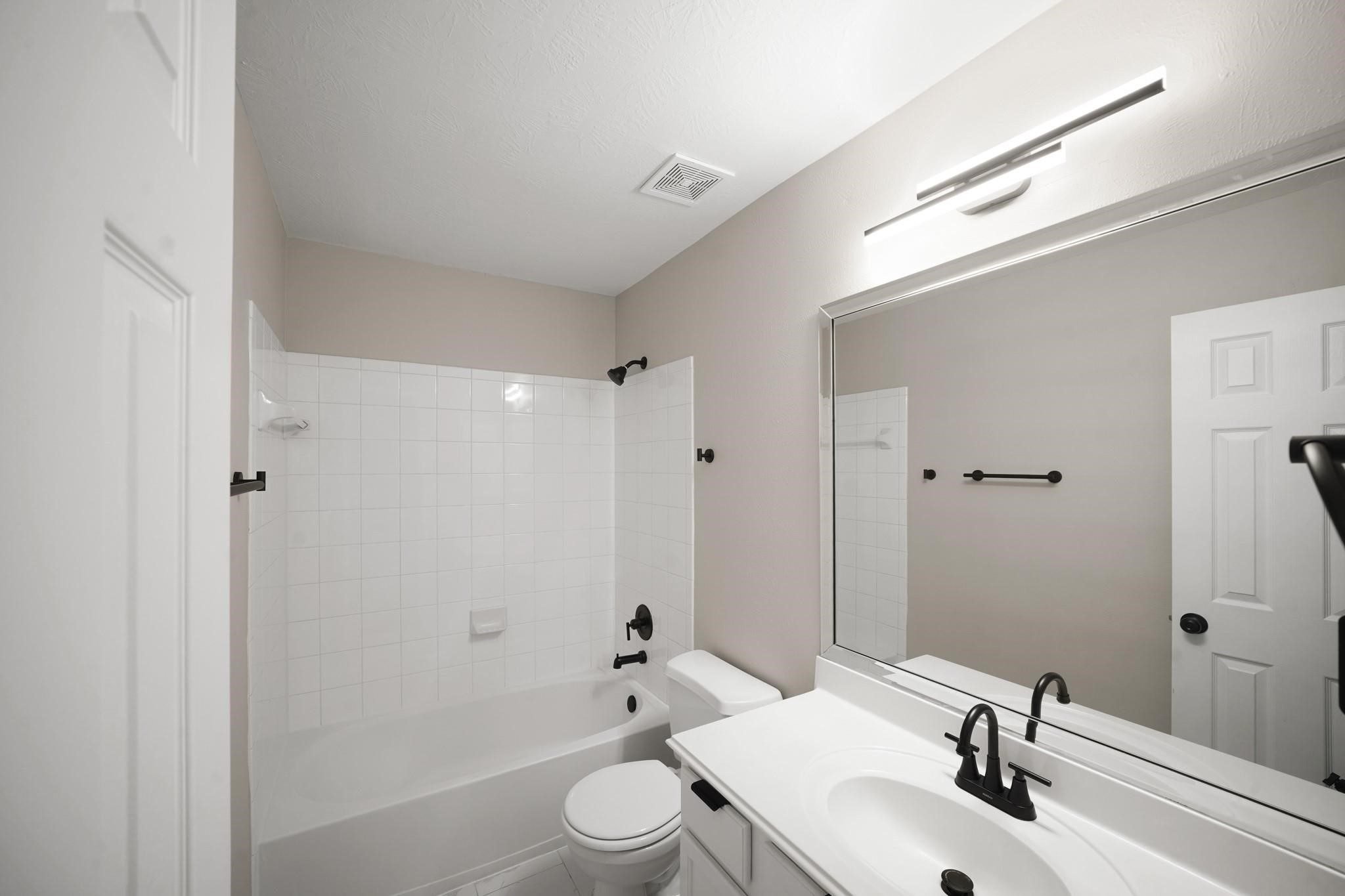 714 Coggins Point Way Sugar Land, TX 77479 - Photo 26 of 32 a bathroom with a sink toilet and shower