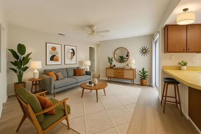 a living room with furniture a rug and a lamp