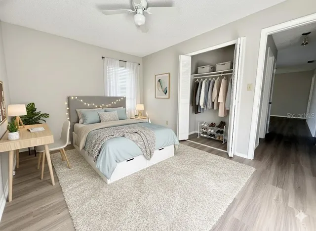 a bedroom with a bed and a table