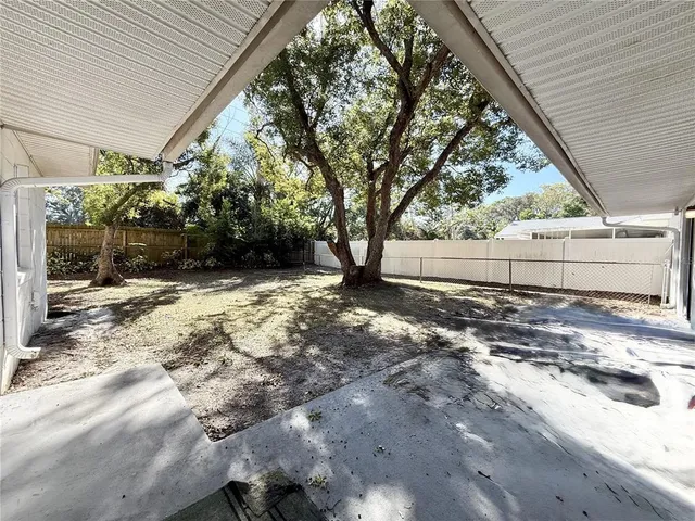 a view of backyard with green space