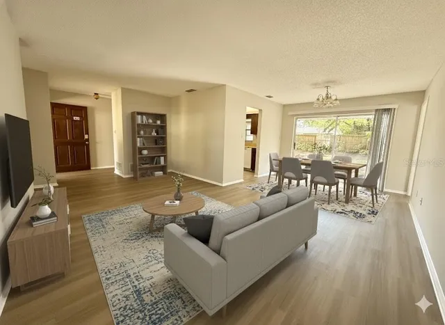 a living room with furniture and a large window