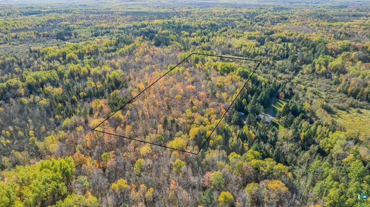 5570 Lester River Road Duluth, MN 55804 - Photo 4 of 11 Aerial view of property and surrounding area featuring property parcel outlined and a forest