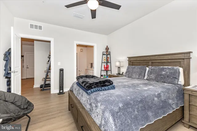 a bedroom with a bed and a desk