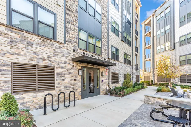 a building with potted plants in front of it
