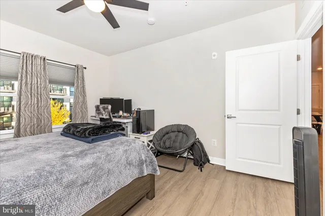 a bathroom with a double vanity sink a toilet and a mirror