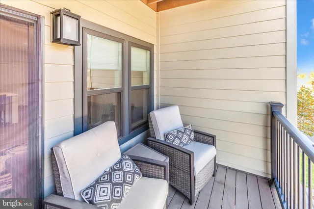 a view of a balcony with wooden floor