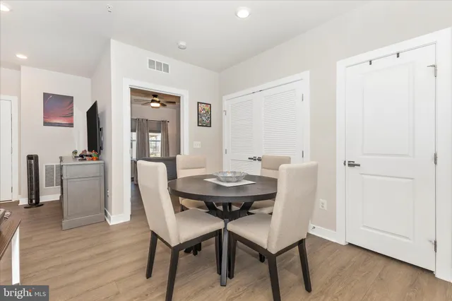 a kitchen with a dining table and chairs