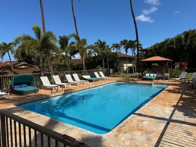 3788 Lower Honoapiilani Road, Unit A211 Lahaina, HI 96761 - Photo 3 of 4 a view of a swimming pool with lounge chairs