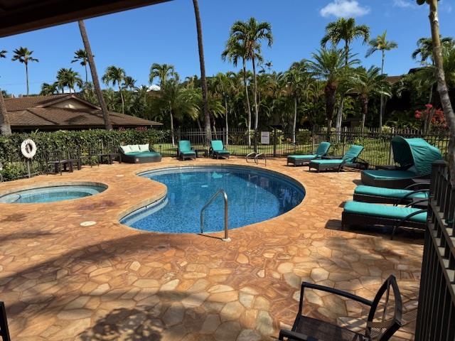 3788 Lower Honoapiilani Road, Unit A211 Lahaina, HI 96761 - Photo 4 of 4 a view of a swimming pool with lounge chair