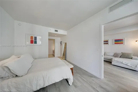 a bedroom with a bed and furniture