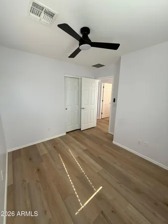 a view of a room with wooden floor