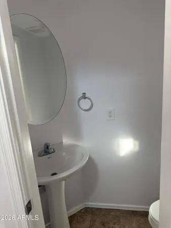 a white toilet sitting next to a shower