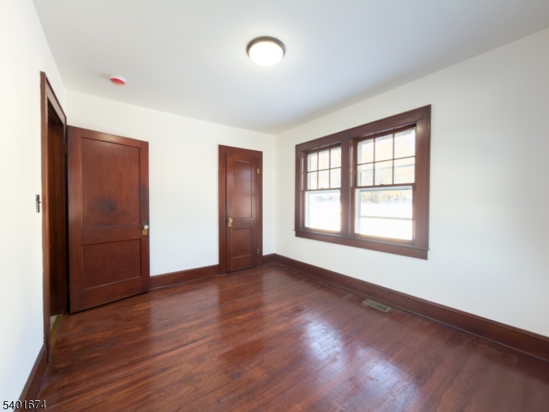 24 Hope Road Great Meadows, NJ 07838 - Photo 12 of 26 an empty room with wooden floor and windows