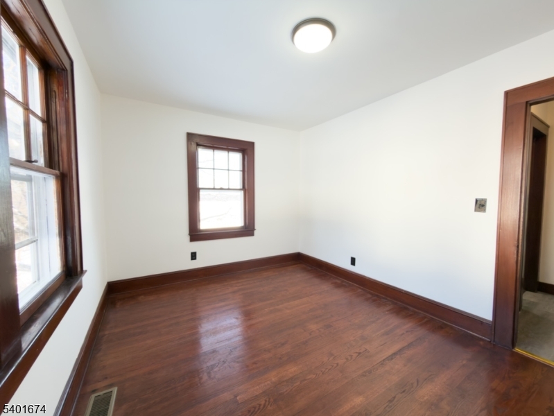 24 Hope Road Great Meadows, NJ 07838 - Photo 13 of 26 an empty room with wooden floor and windows