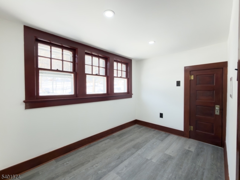 24 Hope Road Great Meadows, NJ 07838 - Photo 14 of 26 an empty room with wooden floor and windows