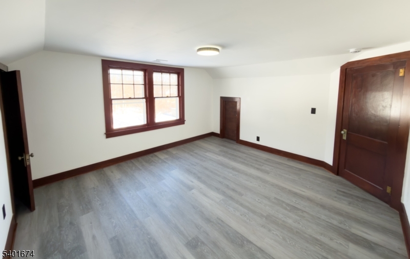 24 Hope Road Great Meadows, NJ 07838 - Photo 17 of 26 an empty room with wooden floor and windows