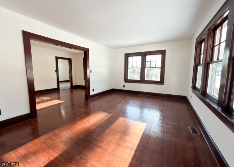 24 Hope Road Great Meadows, NJ 07838 - Photo 2 of 26 a view of an empty room with wooden floor and a window