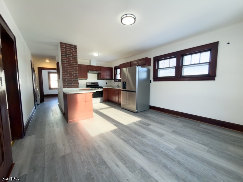 24 Hope Road Great Meadows, NJ 07838 - Photo 6 of 26 a living room with stainless steel appliances kitchen island granite countertop wooden floors and a large window