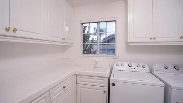 a view of storage and utility room with washer and dryer