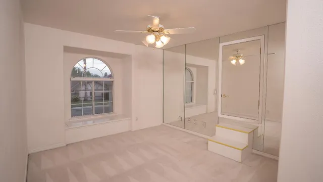 a view of an empty room with a window