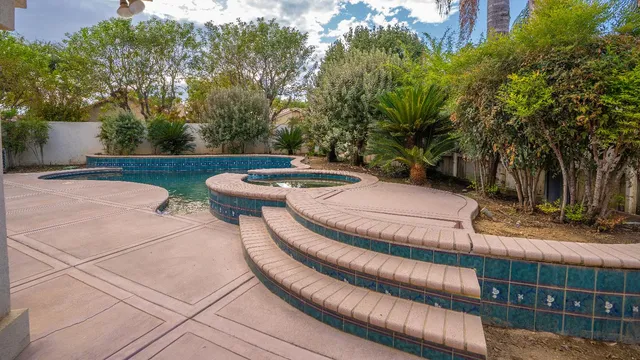 a view of a chairs and table in the patio