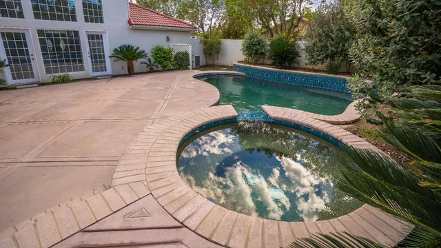 a view of swimming pool from a balcony