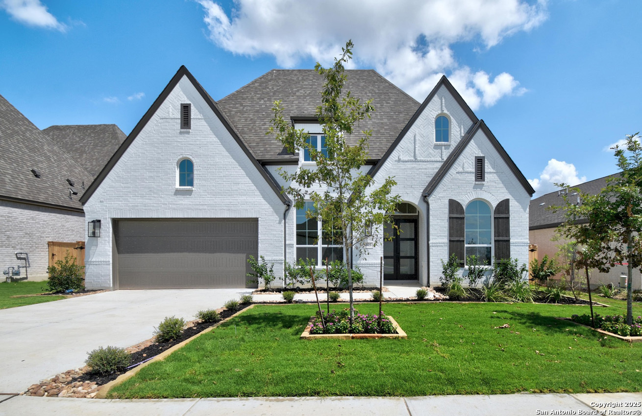 309 Barton Boerne, TX 78006 - Photo 1 of 1 a front view of a house with a yard and garage