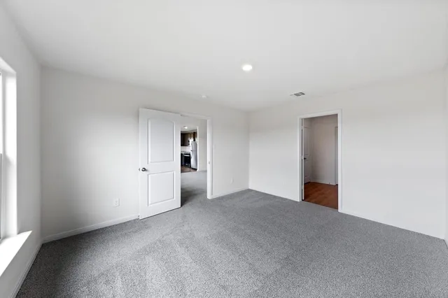 a view of empty room with windows