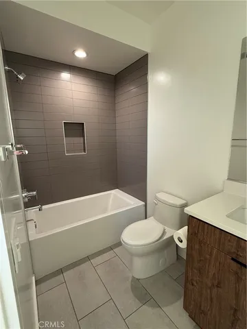a bathroom with a toilet a sink and bathtub