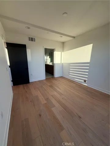 a view of a livingroom with wooden floor