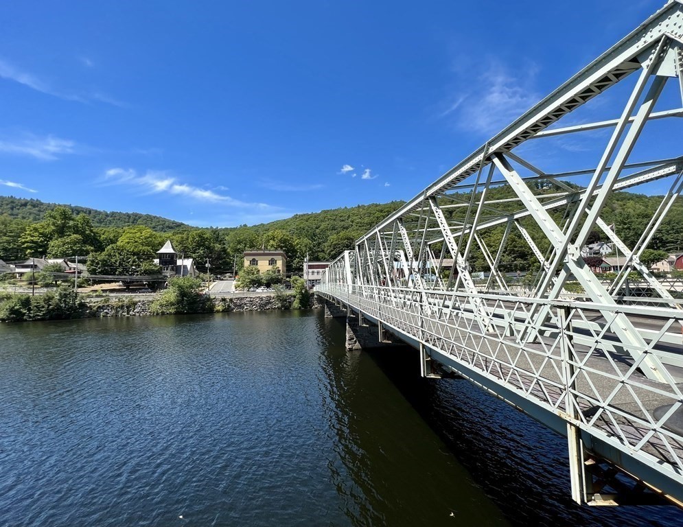 10 Deerfield Avenue, Unit 2 Shelburne, MA 01370 - Photo 24 of 26 a view of a roof deck with chair and wooden floor