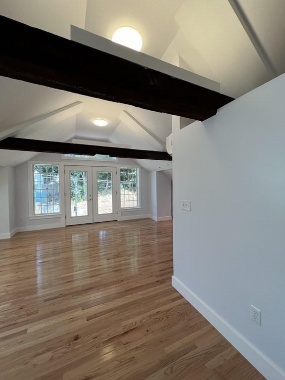 10 Deerfield Avenue, Unit 2 Shelburne, MA 01370 - Photo 10 of 26 a view of an empty room with wooden floor and a window