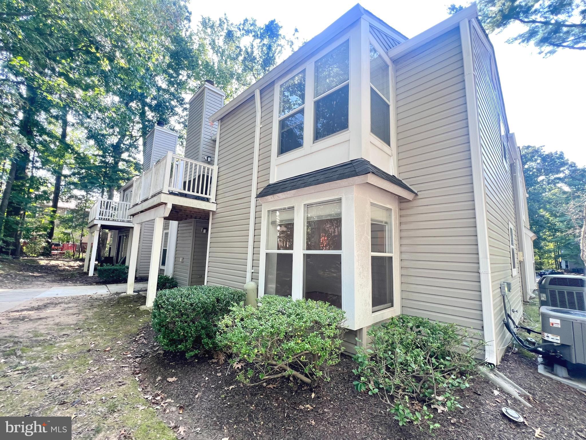 5974 Watch Chain Way, Unit 1001 Columbia, MD 21044 - Photo 1 of 1 a front view of a house with garden