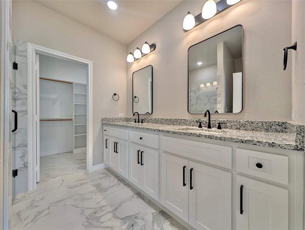 300 Rike Road Mabank, TX 75147 - Photo 8 of 18 a bathroom with a granite countertop sink double and mirror