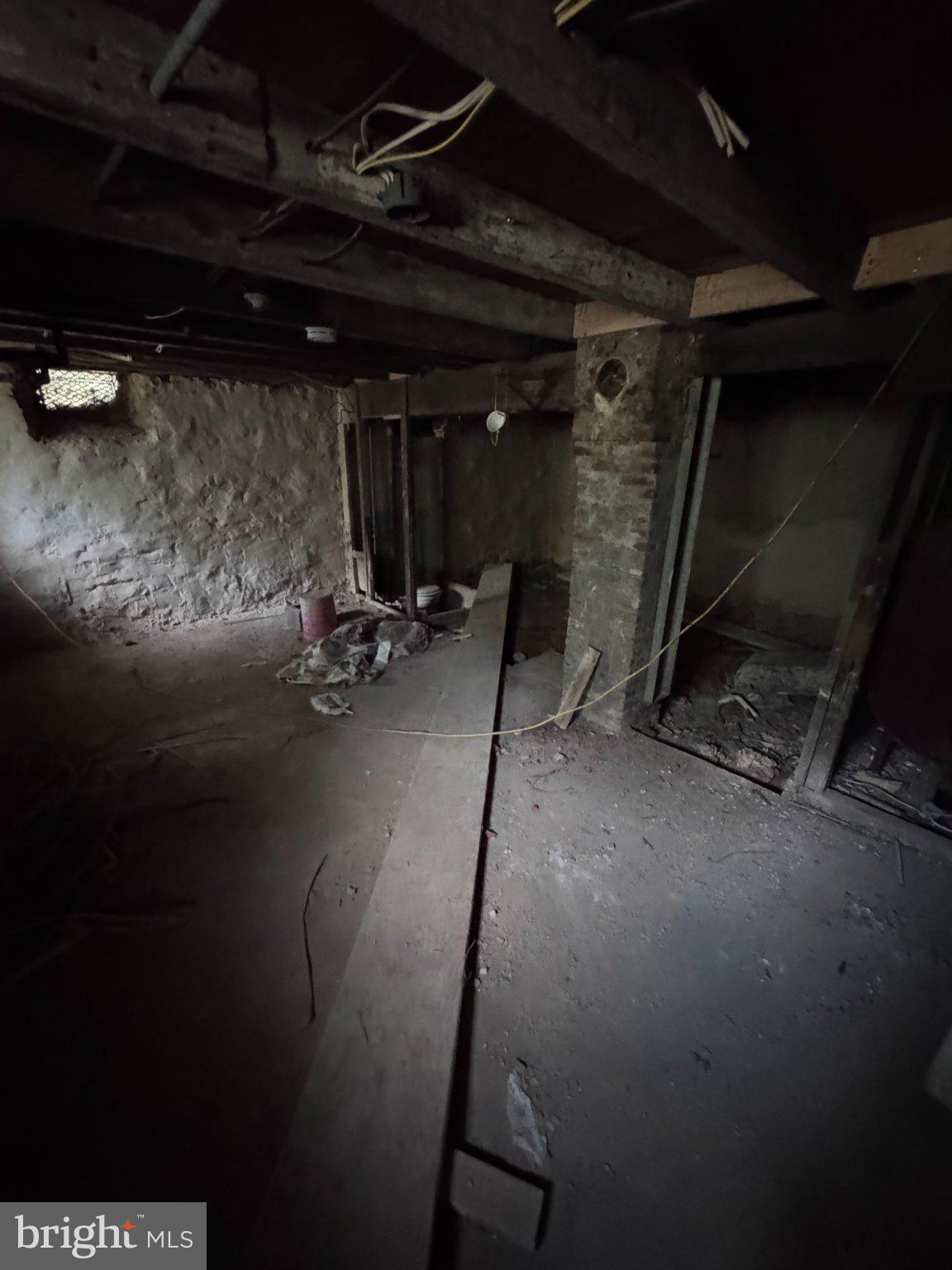 142 Eckman Road Lancaster, PA 17602 - Photo 24 of 25 Dimly lit basement with rustic charm.