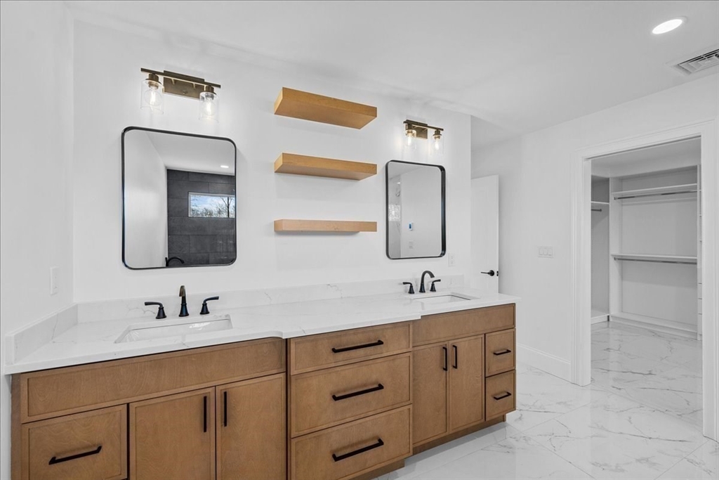 17 Harwood Road Natick, MA 01760 - Photo 15 of 20 a bathroom with a double vanity sink and mirror