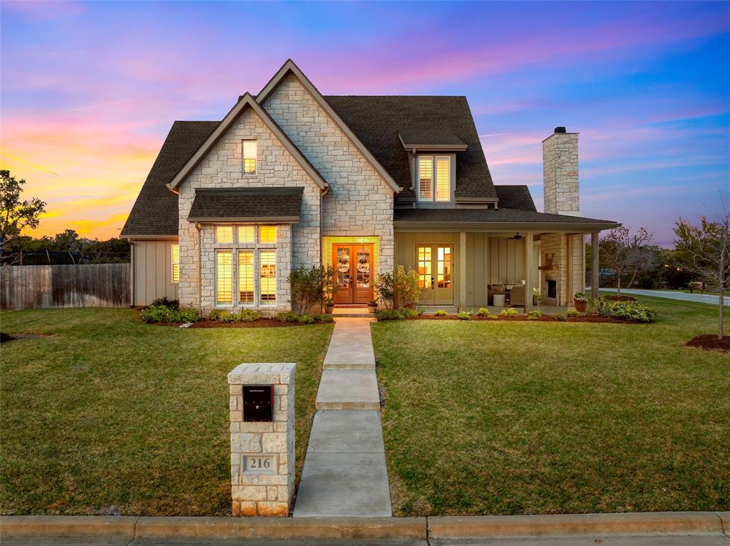 216 Wycliff Drive China Spring, TX 76633 - Photo 1 of 40 a front view of a house with garden