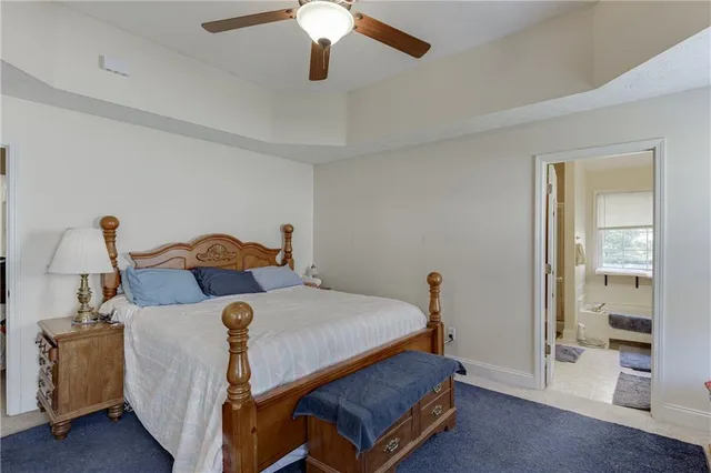 a bed room with a bed and a chandelier