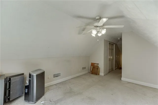 a view of a livingroom with a chandelier fan