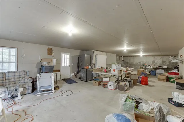 a living room with lots of furniture and a view of chandelier