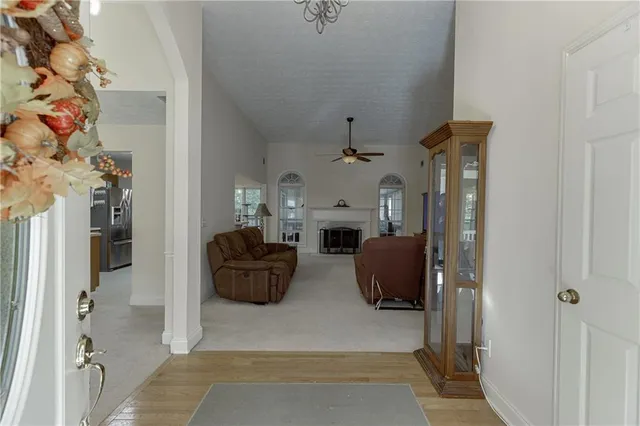a living room with furniture and a fireplace